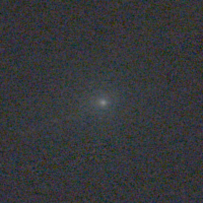 Close-up of the comet's head: a soft round glow with a brighter center